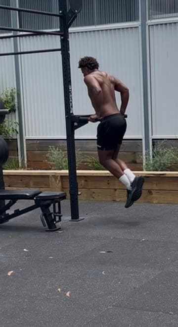 Jordan training dips at the outdoor gym